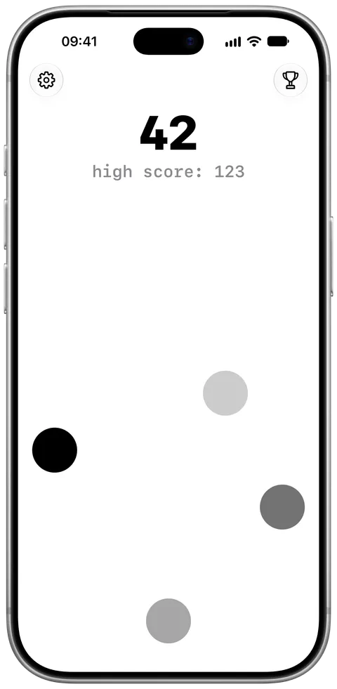 A game in progress, with the score 42 and grey dots scattered over a white screen